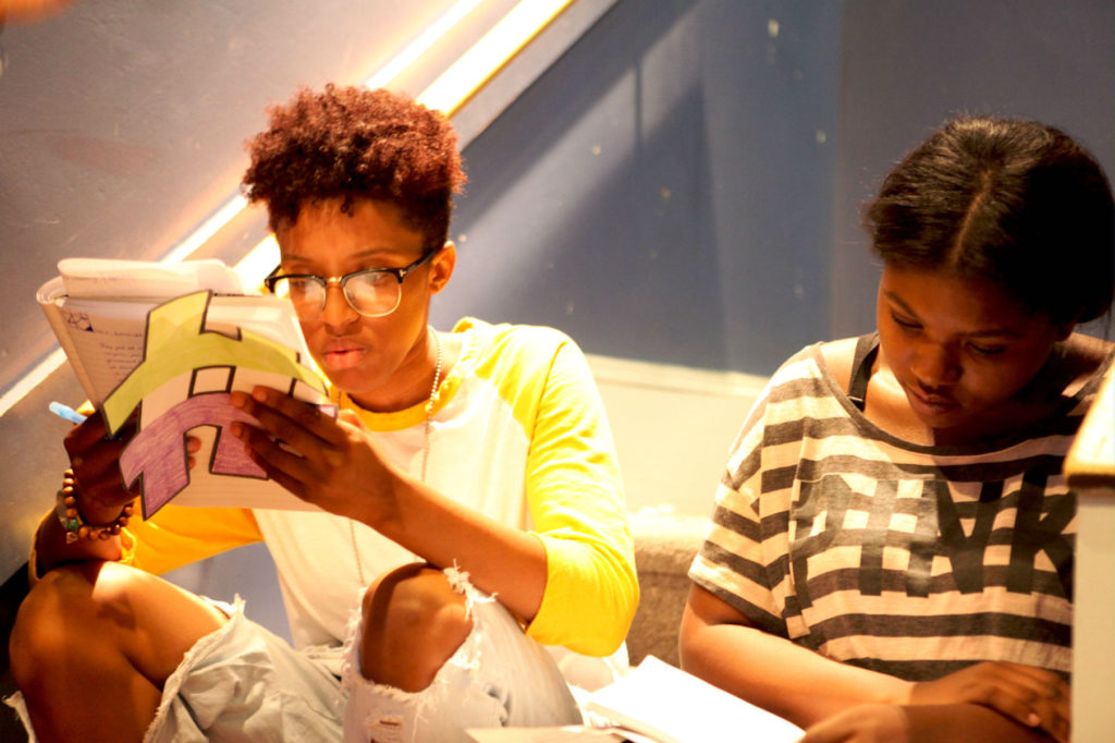 Two students studying together with papers