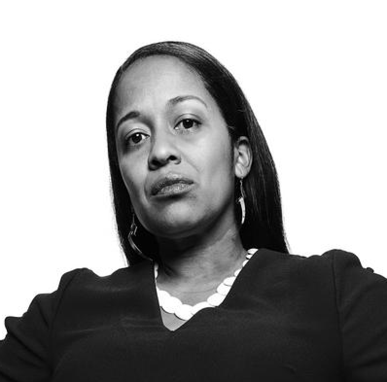 Black-and-white portrait of woman looking at camera