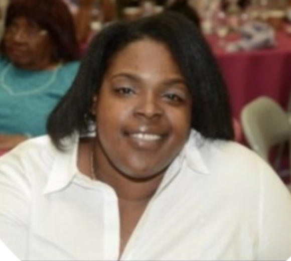Smiling woman at indoor gathering