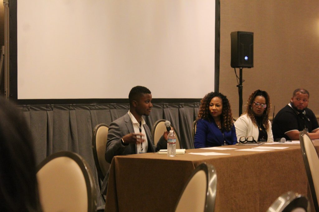 Panel discussion with four speakers at conference