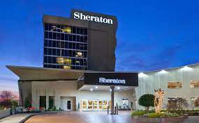 Sheraton hotel exterior and entrance at dusk