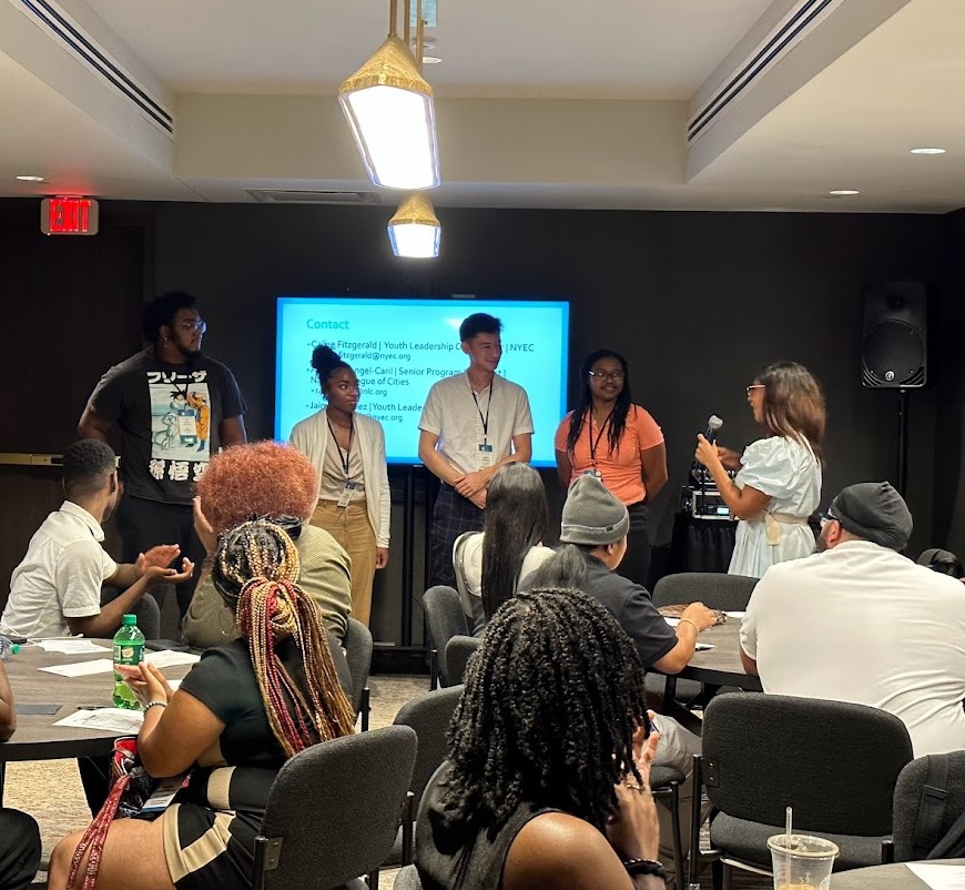 Youth panel presenting to seated audience