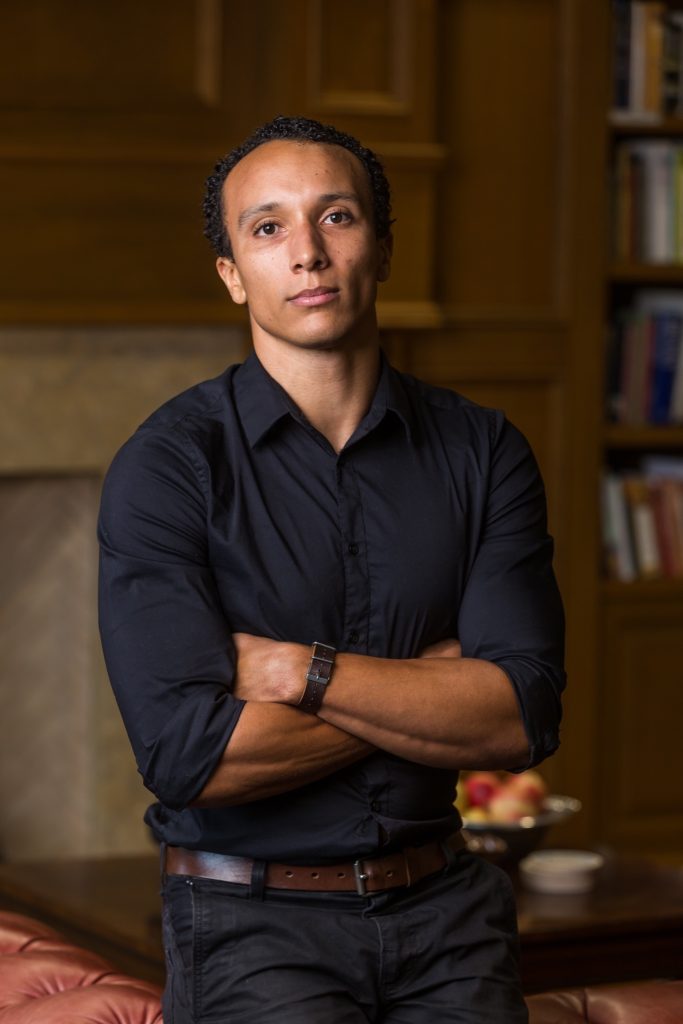 Man in black shirt with arms crossed